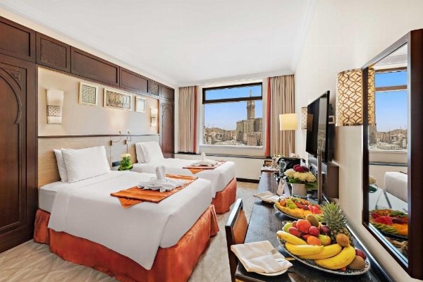 Twin beds facing Makkah skyline from Anjum Hotel