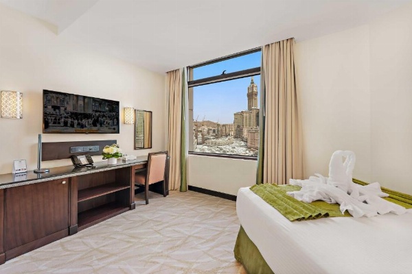 Comfortable room with media setup at Anjum Mecca